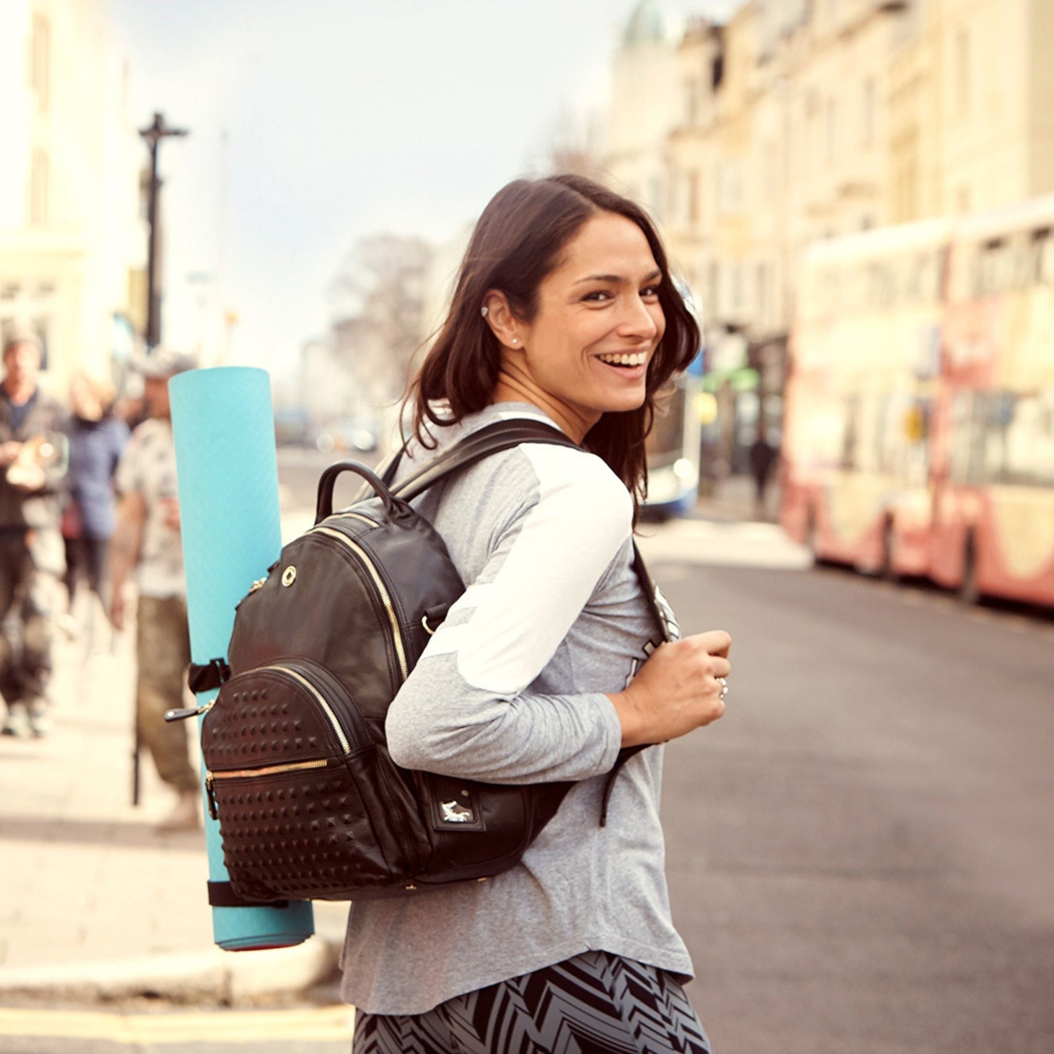 yoga mat clips carrying yoga mat attached to joy xl ladies backpack on models back