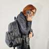 womens black leather backpack for work, travel and modern parenting 