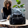 woman at work with her trusty amber black leather  ladies laptop organiser bag