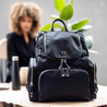 At work with her stylish amber black nylon leather backpack with multiple organiser pockets