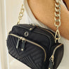 stylish black nylon leather cross body bag accessorised with gretchen chain strap