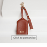 toffee leather luggage tag and keyring with light gold hardware and personalisation on back